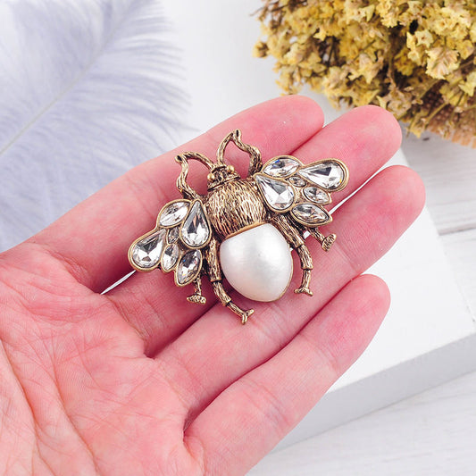 Golden/White Embellished Insect Brooch