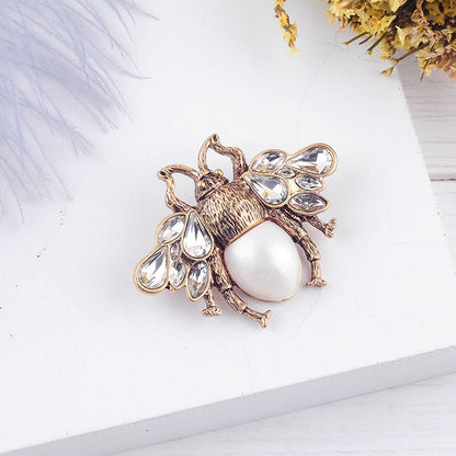 Golden/White Embellished Insect Brooch